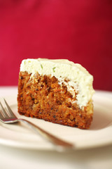 close up carrot cheese cake in white dish