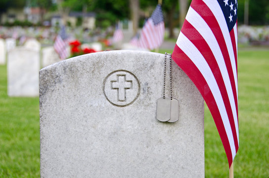 Military Dog Tags On Veteran's Grave