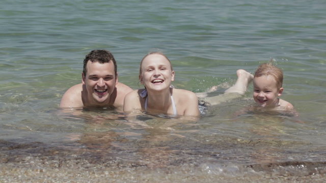 Young family in the sea