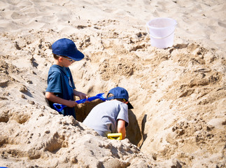 Kids digging in sand