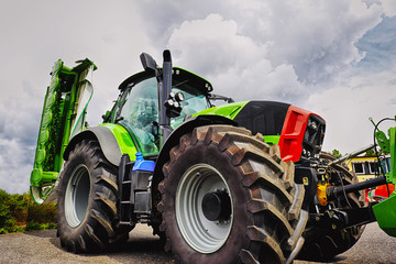 farming tractor and plough, giant tires, latest model