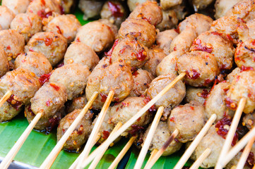 Thai street food close-up with grilled meatballs