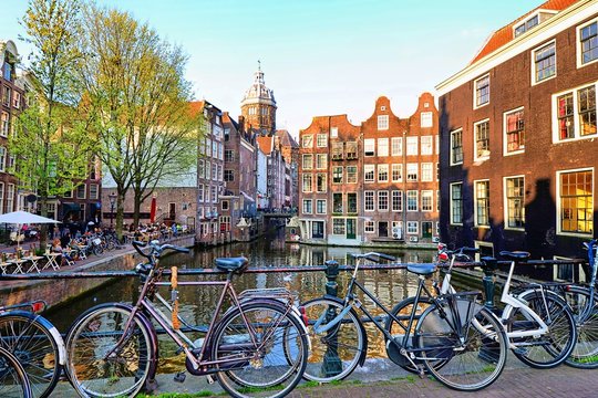Bicycles along the canals of Amsterdam, Netherlands © Jenifoto