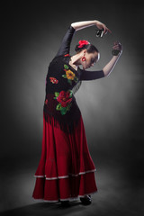 woman dancing flamenco with castanets