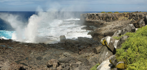 View of cliffs and blowhole in La Espanola island