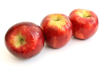Fototapeta na wymiar Three apples on a diagonal