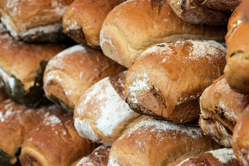 Several loafs of bread in a pile