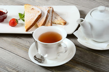 Toasts with powdered sugar and strawberry jam