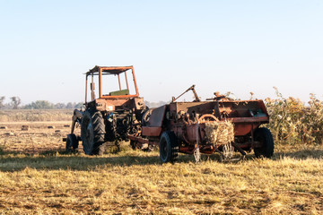 Fototapeta premium Old tractor standing on the field