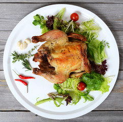 The baked hen with salad