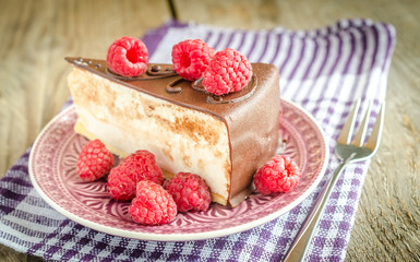 Chocolate cake decorated with fresh raspberries
