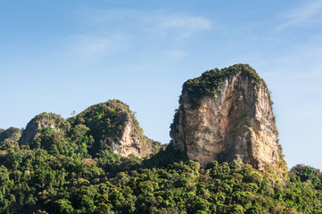 Fototapeta na wymiar rock mountain on blue sky in thailand