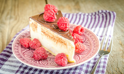 Chocolate cake decorated with fresh raspberries