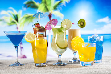  Tropical drinks on beach and sun 
