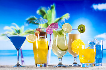 Tropical drinks on beach and sun 