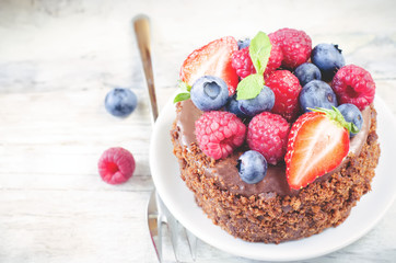 chocolate cake with raspberries, blueberries and strawberries