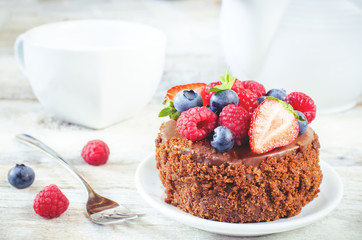 chocolate cake with raspberries, blueberries and strawberries
