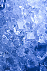 Ice cubes on blue background 