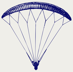 Man jumping with parachute
