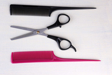 Professional hairdresser tools  on color wooden background