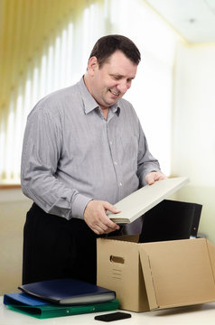 Happy 50y. o. man working in new department