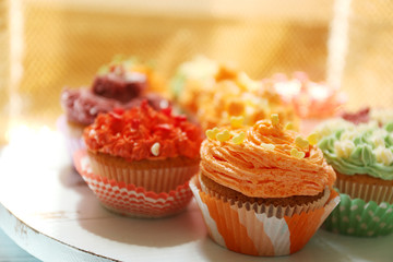 Tasty cupcakes on table, close up