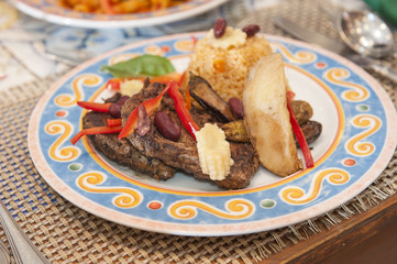 A la carte steak meal on patterned plate