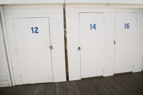 Painted White Wood Storage Doors At Boat Dock