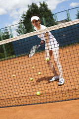  Girl playing tennis on the court