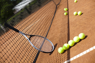 Tennis racket and balls, court