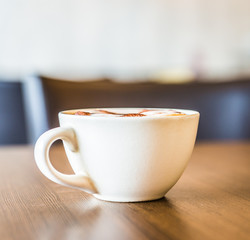 Coffee cup in coffee shop interior