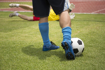 soccer player running before shooting