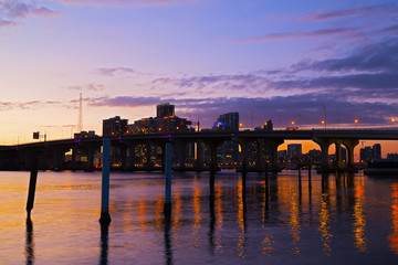 Miami city skyline with the bridge at sunset.