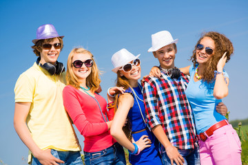 group of young people wearing sunglasses and hat