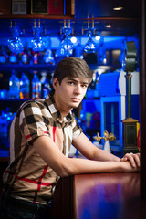 portrait of a young man at the bar