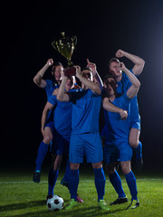 Obraz na płótnie Canvas soccer players celebrating victory