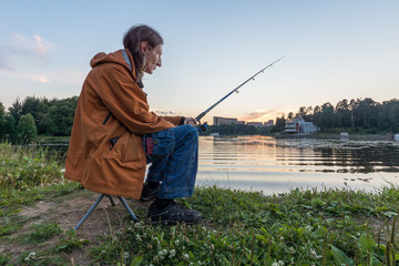 A man fishing on a fishing rod