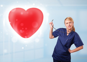 Young nurse healing a red heart