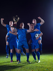 Obraz na płótnie Canvas soccer players celebrating victory