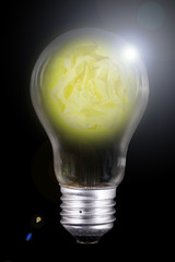 Crumpled Yellow paper inside lamp bulb