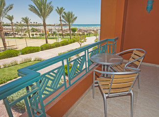 Chairs and table on hotel balcony