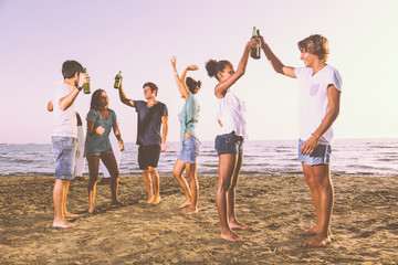 Fototapeta premium Group of Friends Having a Party on the Beach