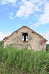 Abandoned ruin house in the field