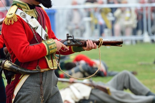 Redcoat firing Musket in re-enactment