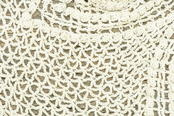 linen mesh on an old wooden surface