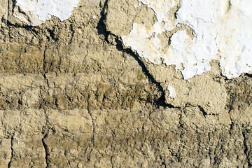 Texture of old brick wall made of clay and straw