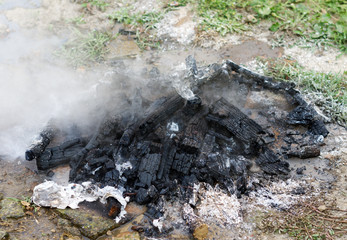 Extinguished smoking bonfire