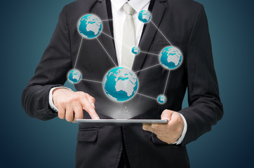 Businessman standing posture hand hold globe map on tablet