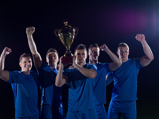 soccer players celebrating victory
