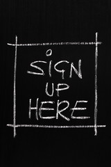 The phrase Sign Up Here written on a blackboard